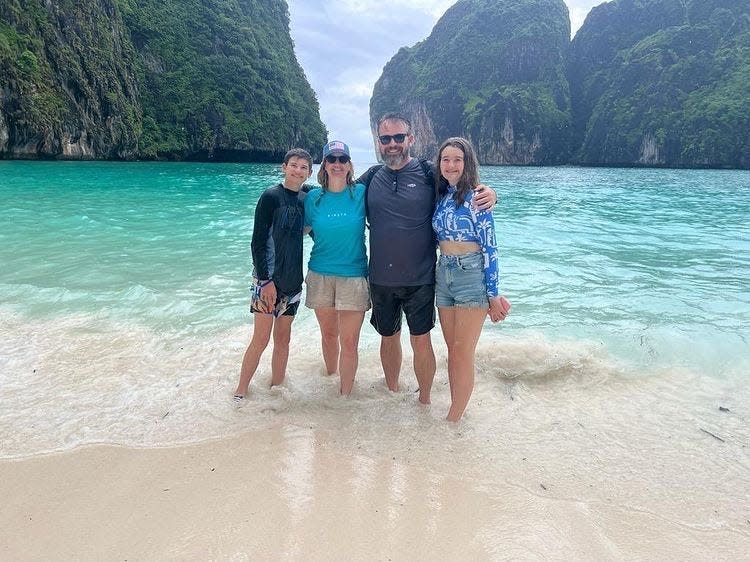 A picture of Werner's family on a beach in Malaysia