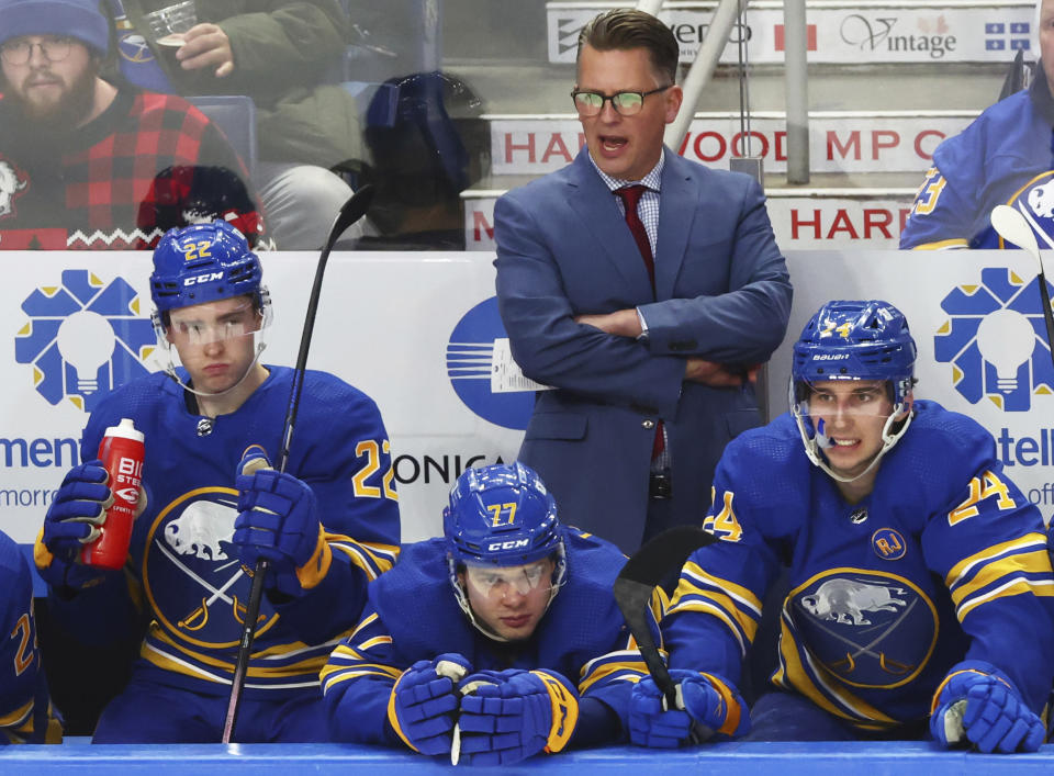 Buffalo Sabres interim head coach Seth Appert, top center, reacts during the third period of an NHL hockey game against the Columbus Blue Jackets, Saturday, Dec. 30, 2023, in Buffalo, N.Y. (AP Photo/Jeffrey T. Barnes)