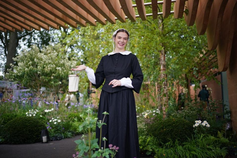 A woman dressed as Florence Nightingale in the Florence Nightingale garden at the RHS Chelsea Flower Show (Yui Mok/PA) (PA Wire)