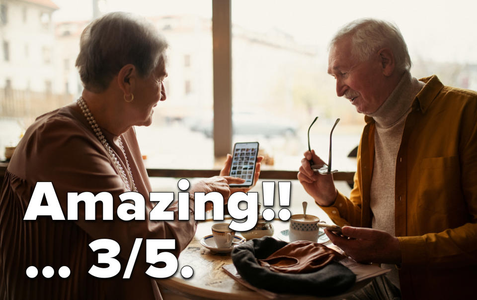 older people on their phone in a cafe