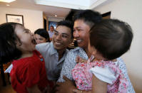 Reuters reporters Wa Lone and Kyaw Soe Oo celebrate with their children after being freed from prison, after receiving a presidential pardon in Yangon, Myanmar, May 7, 2019. REUTERS/Ann Wang/Pool