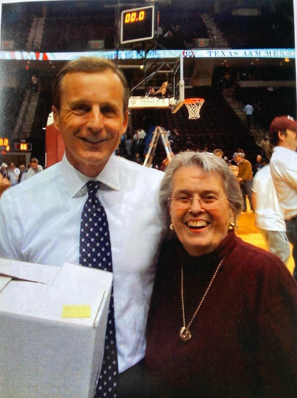 Rick Barnes and Biddy O'Dwyer developed an unlikely friendship when he was the coach at Texas. Barnes is holding a box of "Biddy Bread" on the court at Reed Arena.