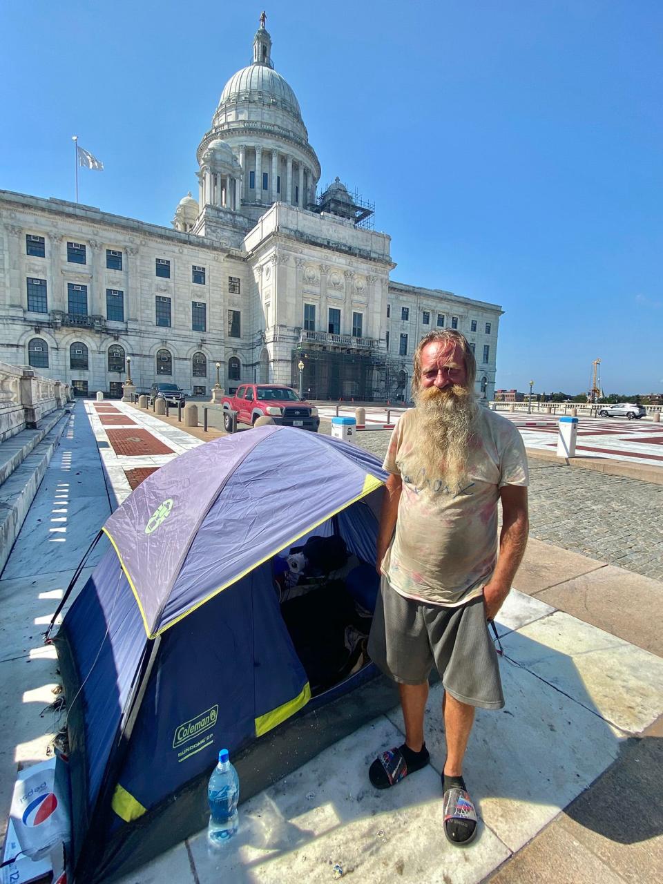 Just over a year ago, Neugent was among the first to make a statement about the need for housing by camping out in a tent on the State House steps. He stayed for weeks, and eventually made his home within sight of the State House.