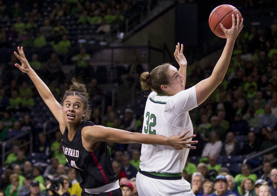 Notre Dame's Jessica Shepard (32) goes up for a shot next to Harvard's Jadyn Bush (24) during the first half of an NCAA college basketball game Friday, Nov. 9, 2018, in South Bend, Ind. (AP Photo/Robert Franklin)