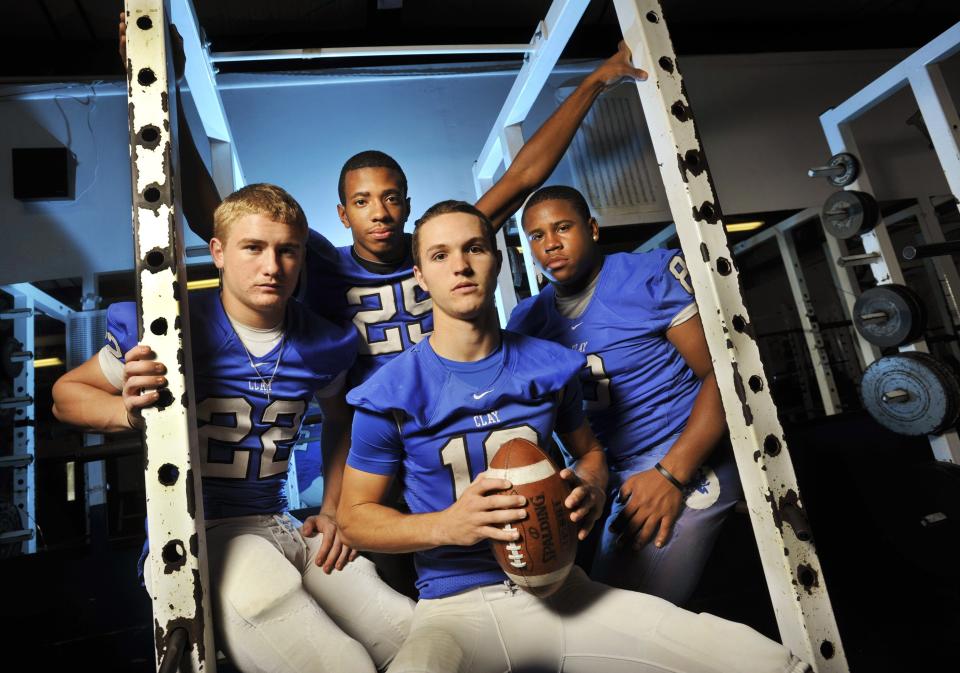 Clay's offensive backfield members J.T. Turner (from left), Bilal Ally, Wes Weeks and Shannon Asbell, photographed four days after the game, combined for 489 rushing yards.