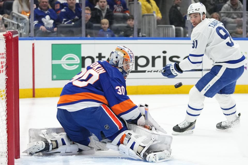 New York Islanders goaltender Ilya Sorokin (30) stops a shot on goal by Toronto Maple Leafs' John Tavares (91) during the first period of an NHL hockey game Thursday, Jan. 11, 2024, in Elmont, N.Y. (AP Photo/Frank Franklin II)