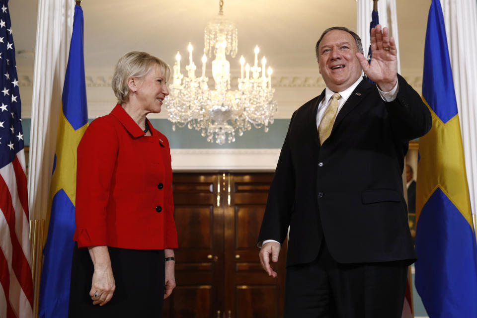 Secretary of State Mike Pompeo, right, waves as he stands alongside Swedish Foreign Minister Margot Wallstrom, Monday, April 29, 2019, at the U.S. State Department in Washington. (AP Photo/Patrick Semansky)
