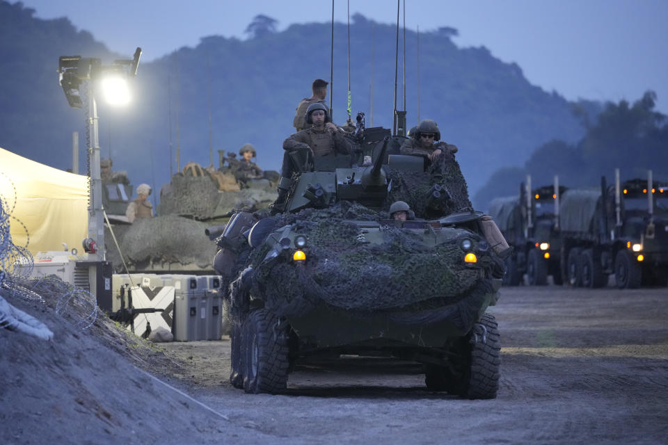 American Marines prepare for annual combat drills between the Philippine Marine Corps and U.S. Marine Corps in Capas, Tarlac province, northern Philippines, Thursday, Oct. 13, 2022. Truck-mounted launchers blasted off rockets Thursday and U.S. stealth fighter jets streaked across the northern Philippine sky in a combat drill and latest display of American firepower in a region where Washington has tried to deter what it warns as China's growing aggression. (AP Photo/Aaron Favila)