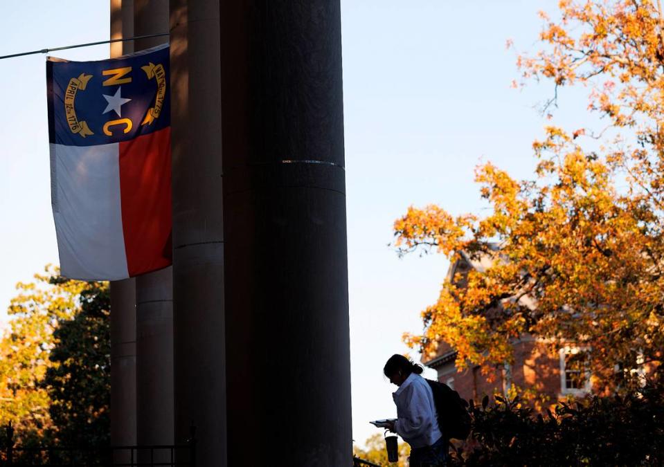 A North Carolina flag flies above South Building on the campus of UNC-Chapel Hill on Monday, Oct. 30, 2023.