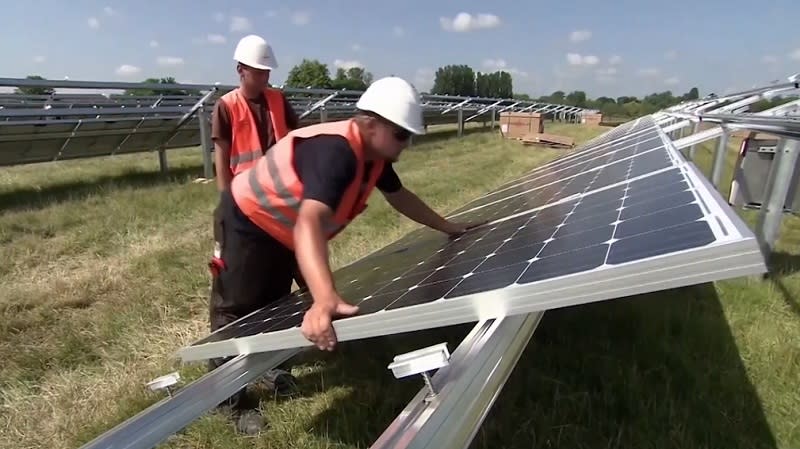 Crews install solar panels, undated (Nexstar)