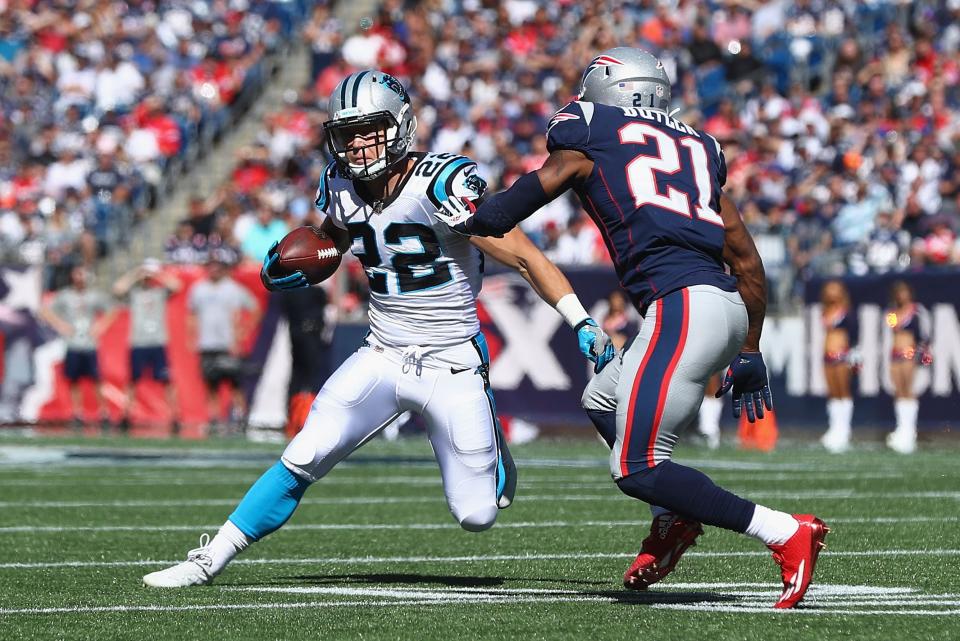 FOXBORO, MA - OCTOBER 01:  Christian McCaffrey #22 of the Carolina Panthers runs with the ball against Malcolm Butler #21 of the New England Patriots during the first half at Gillette Stadium on October 1, 2017 in Foxboro, Massachusetts.  (Photo by Maddie Meyer/Getty Images)