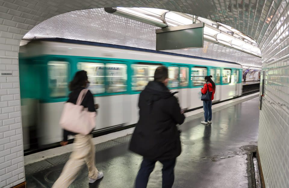 Passengers use the Paris Metro