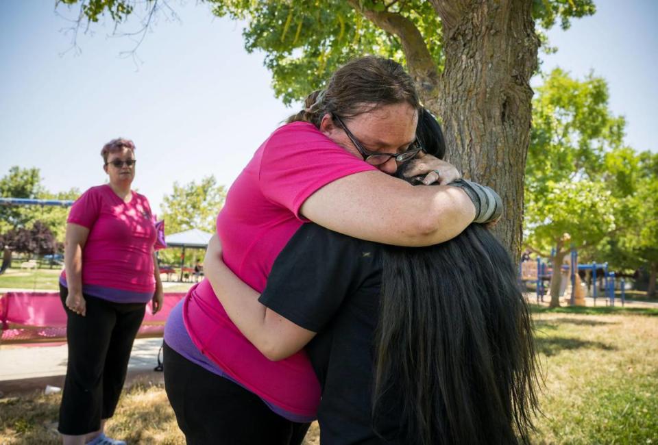 Opál McCartney, center, embraces Kylee Stone, close friend of Mia Alaina-Lorene Knight, at POW/MIA Park in Linda on July 1 wile honoring the life Knight. “This is a place that Mia came to when Mia wasn’t feeling safe, this where she ran to,” McCartney said. The young transgender woman from the Yuba-Sutter area died May 31 by suicide due to bullying, friends and family said.