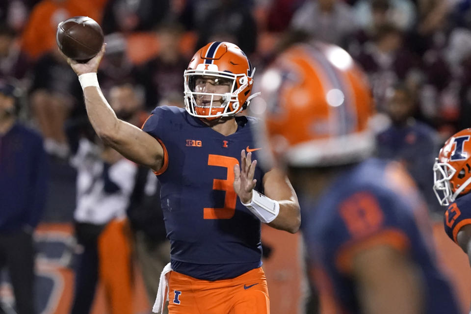 Illinois quarterback Tommy DeVito throws a pass during the first half of the team's NCAA college football game against Chattanooga on Thursday, Sept. 22, 2022, in Champaign, Ill. (AP Photo/Charles Rex Arbogast)