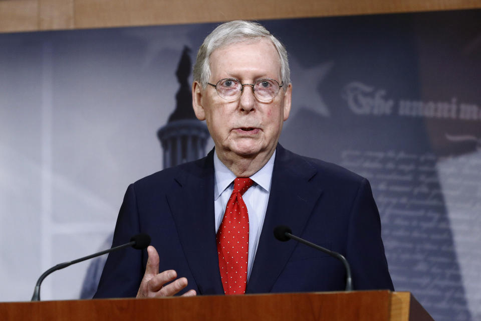 FILE - In this April 21, 2020, file photo Senate Majority Leader Mitch McConnell of Ky., speaks with reporters after the Senate approved a nearly $500 billion coronavirus aid bill on Capitol Hill in Washington. House Speaker Nancy Pelosi shelved a proposal for proxy voting this week after Republicans objected. In the Senate, McConnell rejected a GOP remote vote proposal. He expects Congress to return May 4, as planned. (AP Photo/Patrick Semansky, File)