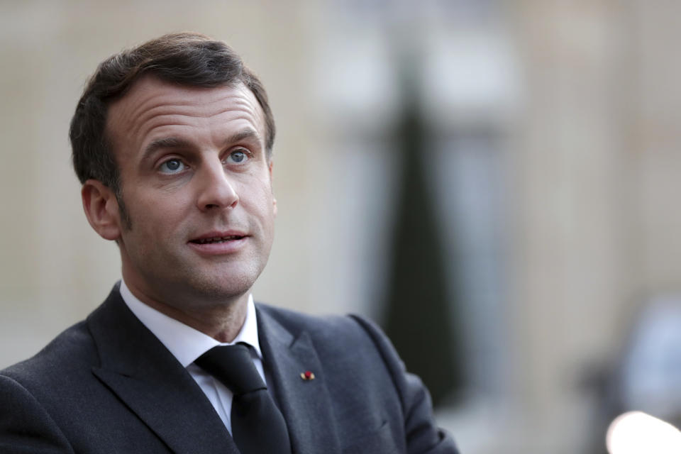 French President Emmanuel Macron delivers a speech at the end of a meeting with Mohammad Younes Menfi, president of Libya's Presidential Council and Musa al-Koni, vice-president of Libya's Presidential Council, at the Elysee Palace, in Paris, Tuesday, March 23, 2021. Macron said France will reopen its embassy in Libya's capital Tripoli on Monday as a gesture of support for the new interim government. (AP Photo/Thibault Camus)