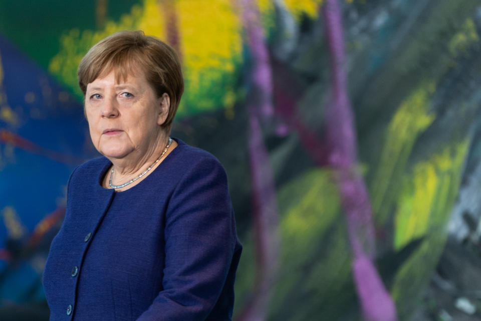 BERLIN, GERMANY - MARCH 13: German Chancellor Angela Merkel walks to a press statement prior to meeting with economic and labor unions leaders at the Chancellery on March 13, 2020 in Berlin, Germany. The meeting is taking place as the government prepares further measures to buffer the economy against the effects of the coronavirus epidemic. The number of confirmed cases in Germany has topped 2,700 with a heavy impact on public life becoming more and more apparent. (Photo by Hayoung Jeon - Pool / Getty Images)