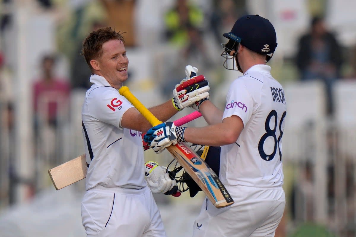 England’s Ollie Pope, left, celebrates with Harry Brook (AP) (AP)