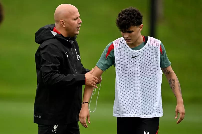 Arne Slot head coach of Liverpool with Stefan Bajcetic of Liverpool during a training session at AXA Training Centre on July 07, 2024 in Kirkby, England.