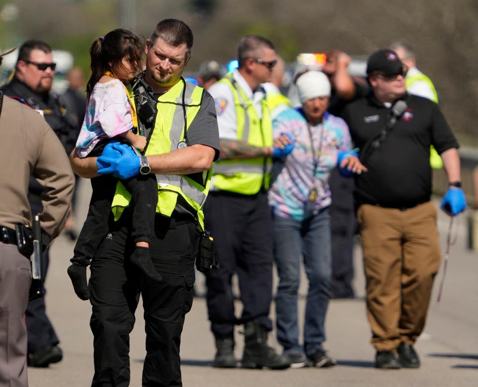 People are transported from a fatal school bus crash on SH 21 near Caldwell Road Friday March 22, 2024.

Editor's note: The Austin American-Statesman is publishing photos of first responders and children following the school bus crash after careful consideration to document the breaking news and public safety nature of the incident.