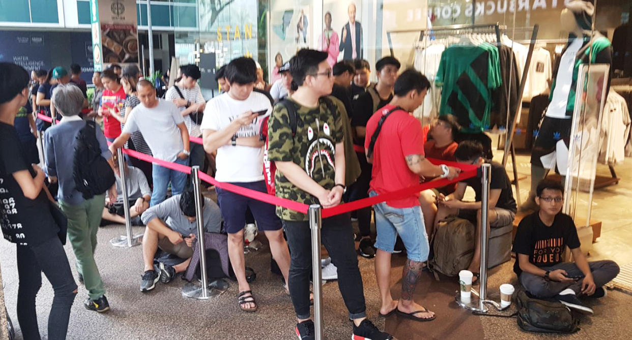 iQueue service providers in action before the sale of Adidas sneakers, NMD Triple Black. (Photo: Jeffrey Tan / iQueue)