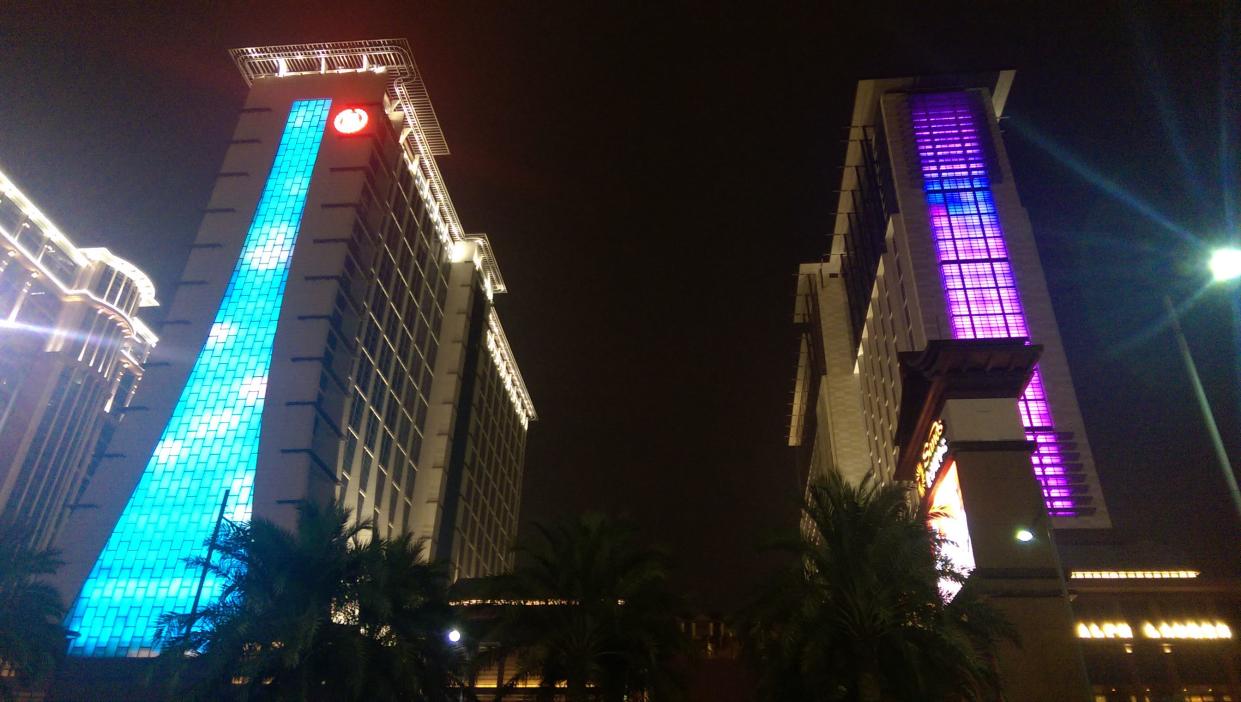 Blue and purple lit up Sheraton Grand Macao.