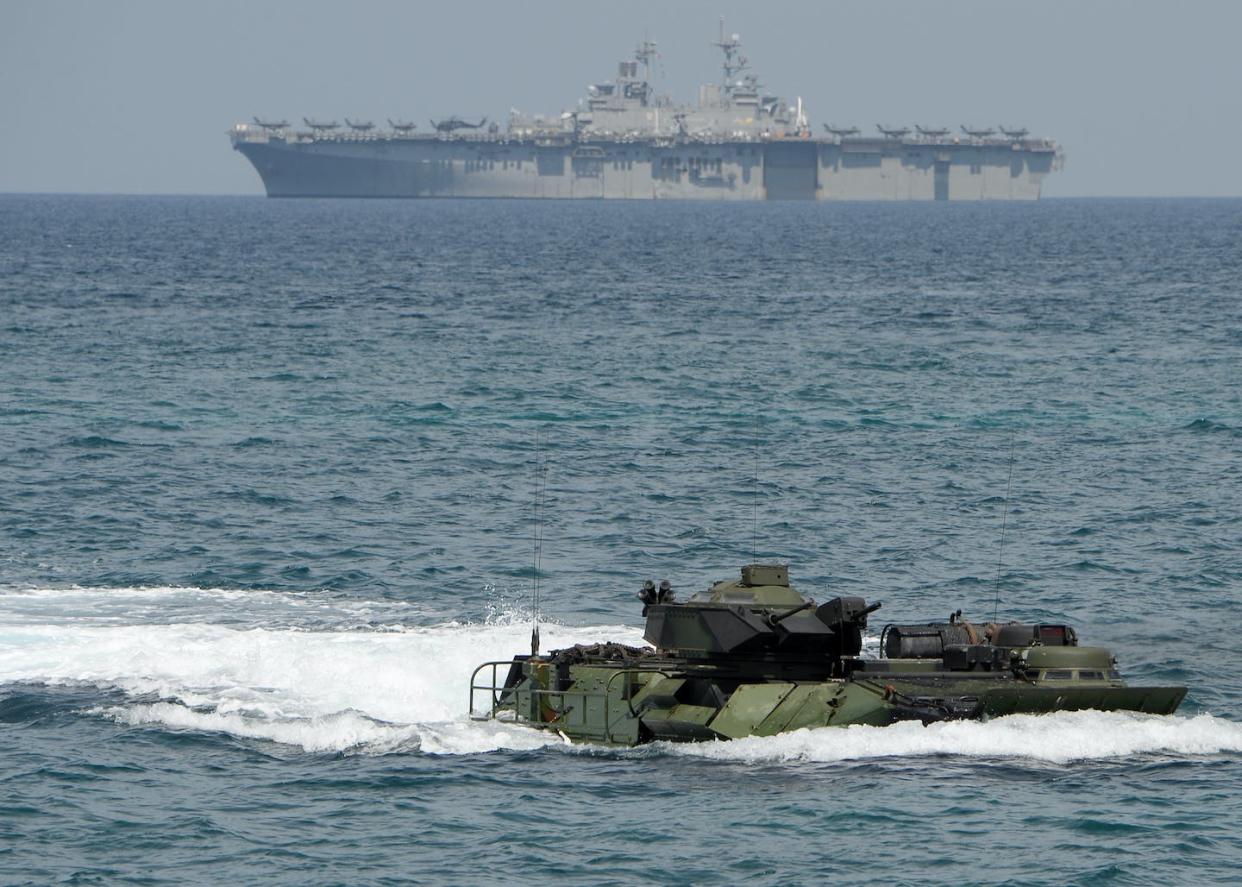 A Marine amphibious assault vehicle takes part in a 2019 joint U.S.-Philippines exercise. <a href="https://www.gettyimages.com/detail/news-photo/marine-amphibious-assault-vehicle-maneouvers-before-the-uss-news-photo/1136245278?adppopup=true" rel="nofollow noopener" target="_blank" data-ylk="slk:Ted Aljibe/AFP via Getty Images;elm:context_link;itc:0;sec:content-canvas" class="link ">Ted Aljibe/AFP via Getty Images</a>