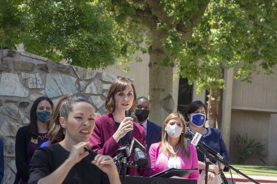 Schools Superintendent Kathy Hoffman is joined by school counselors and others where she announced more funding for a program that will put counselors, social-workers into schools at the Arizona Capitol Rose Garden  on April 19, 2021. This eliminates a two-year wait list for the popular program