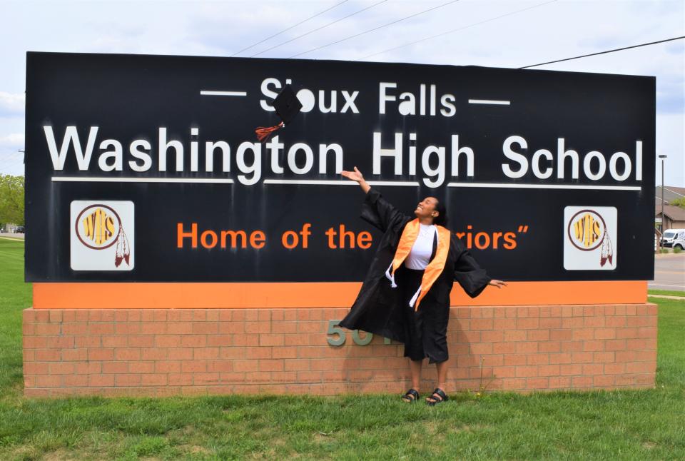 Susana Gebrekidan, a senior at Washington High School, prepares to graduate with the Class of 2022 this week. Susana tosses her cap at WHS on May 24, 2022.