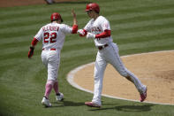 Los Angeles Angels' David Fletcher, left, greets designated hitter Shohei Ohtani after they scores on a ground-rule double by Jared Walsh during the third inning of a baseball game against the Los Angeles Dodgers in Anaheim, Calif., Sunday, May 9, 2021. (AP Photo/Alex Gallardo)