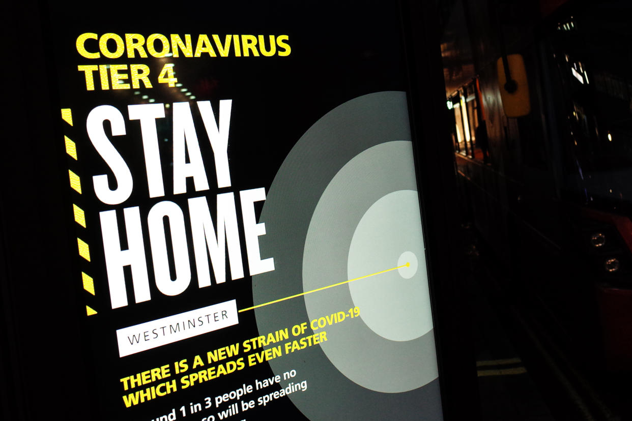 A notice informing people of 'Tier 4' coronavirus restrictions lights up a digital advertising screen on Oxford Street in London, England, on December 21, 2020. London spent its second day of what could be months under the newly-introduced Tier 4 restrictions today. Under Tier 4 rules non-essential shops and many other businesses including gyms and hairdressers must close, with people instructed to stay at home other than for exempted circumstances including travel to work or education. Indoor mixing between those in different households is also banned under the new tier, upending Christmas plans for a huge swathe of the population. Concern over a more infectious strain of the coronavirus in the UK has meanwhile seen dozens of countries ban arrivals from Britain, with food supplies also disrupted after France closed the cross-Channel freight route from Dover. (Photo by David Cliff/NurPhoto via Getty Images)