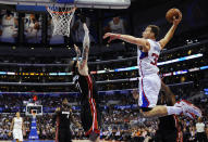 FILE - Los Angeles Clippers forward Blake Griffin, right, goes up for a dunk as Miami Heat forward Chris Andersen, center, defends and forward LeBron James, second from left, and forward Matt Barnes watch during the first half of an NBA basketball game, Wednesday, Feb. 5, 2014, in Los Angeles. Griffin announced his retirement Tuesday, April 16, 2024, after a 14-year career that included six All-Star selections, Rookie of the Year honors and a dunk contest victory. (AP Photo/Mark J. Terrill, File)