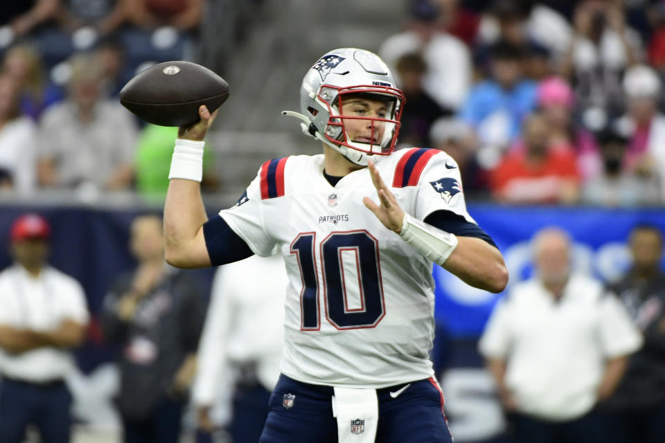 New England Patriots quarterback Mac Jones (10) throws a pass against the Houston Texans during the first half of an NFL football game Sunday, Oct. 10, 2021, in Houston. (AP Photo/Justin Rex)