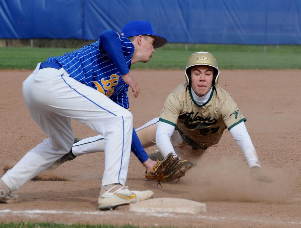 St. Mary Catholic Central's Aiden Burrous steals third base as the ball got away from Jefferson third baseman Keegan Stefko Wednesday. SMCC won 11-2.
