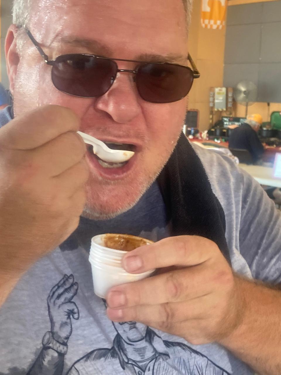 Randy Anders of Chatham takes a bite of chili at the Illinois State Fair Chili Cookoff at The Shed Sunday. Gary Ballweg of Springfield won the People's Choice award with his tavern style chili.