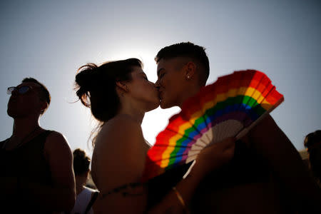 Revellers take part in a gay pride parade in Tel Aviv, Israel June 8, 2018. REUTERS/Corinna Kern