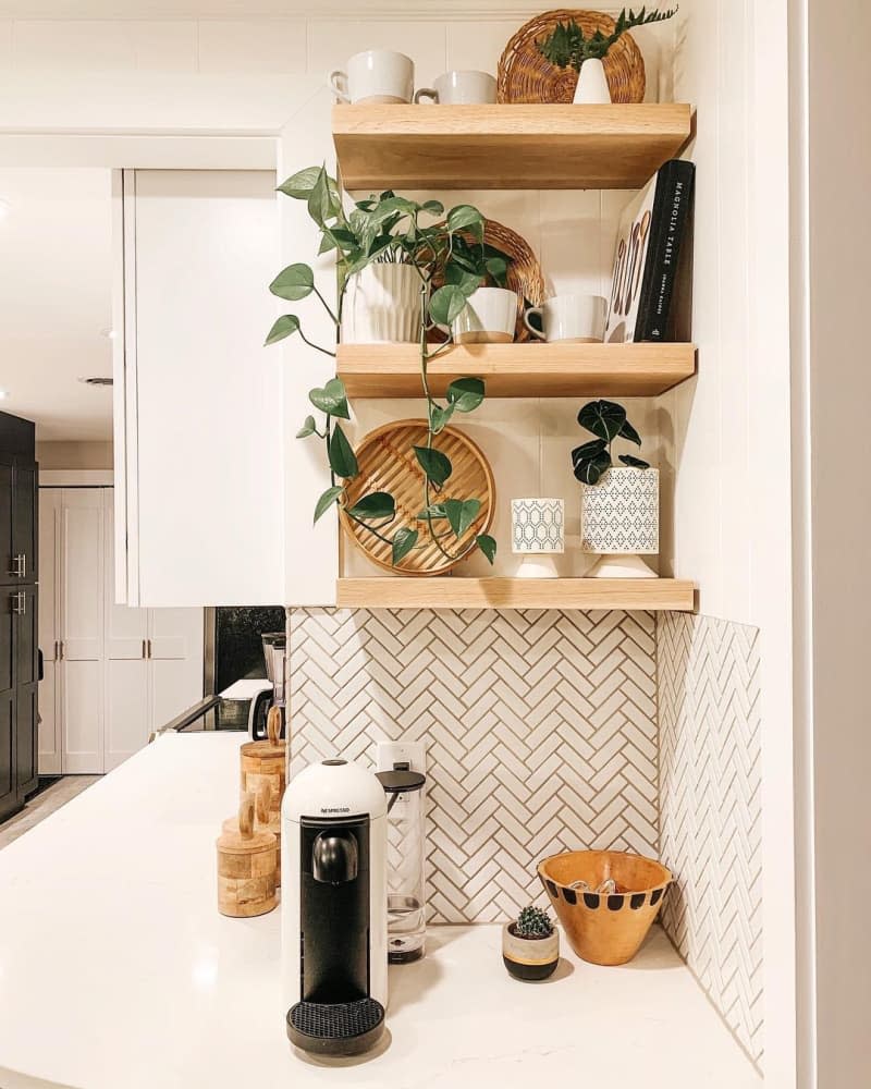 coffee bar area on counter corner under open shelves