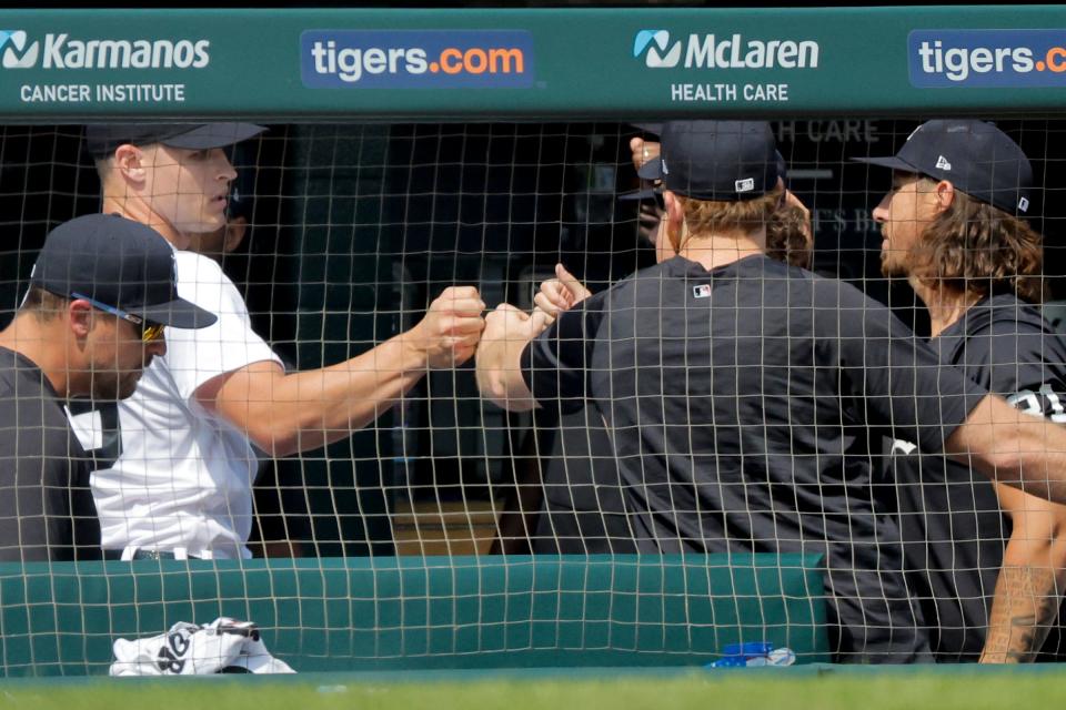 Detroit Tigers starting pitcher Matt Manning (left) receives congratulations from teammates after being relieved in the seventh inning against the Toronto Blue Jays at Comerica Park in Detroit, Michigan on July 8, 2023.