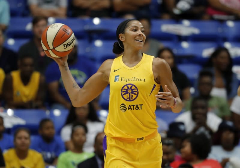 Los Angeles Sparks' Candace Parker makes a pass during a WNBA basketball game against the Dallas Wings in Arlington, Texas, Wednesday, Aug. 14, 2019. (AP Photo/Tony Gutierrez)
