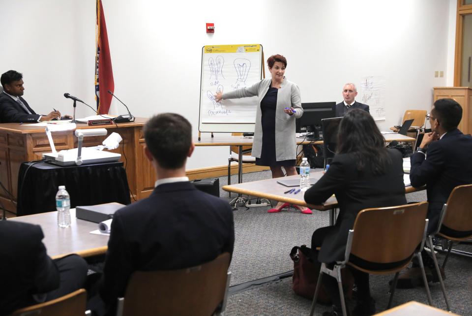 Sreenivasa Rao Dandamudi, commissioner of the Missouri Administrative Hearing Commission, left, listens to the testimony of Dr.Colleen McNicholas, chief medical officer at Planned Parenthood, on the third day of hearings between Planned Parenthood and Missouri Department of Health and Senior Services on whether Planned Parenthood can keep its abortion license on Wednesday, Oct. 30, 2019, in St. Louis.(Laurie Skrivan/St. Louis Post-Dispatch via AP)