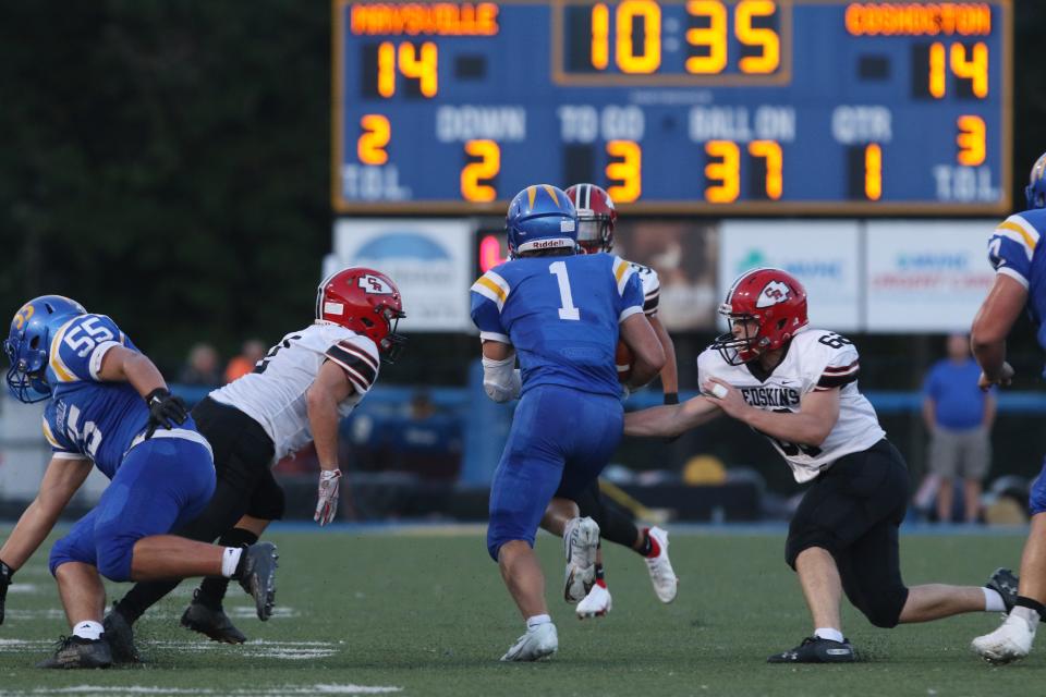 A pair of Coshocton defenders close in on Maysville's Hayden Jarrett. Jarrett, a senior, will be among several skill players returning for the Panthers, who aim to improve on a 3-7 season.