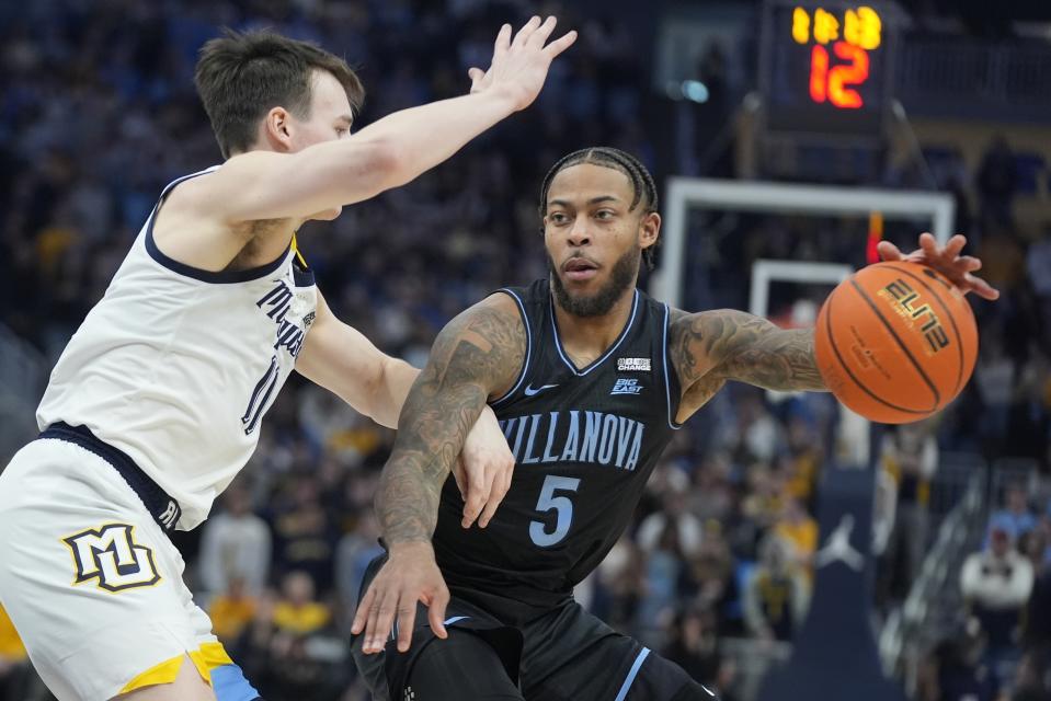 Villanova's Justin Moore tries to get past Marquette's Tyler Kolek during the second half of an NCAA college basketball game Monday, Jan. 15, 2024, in Milwaukee. Marquette won 87-74. (AP Photo/Morry Gash)