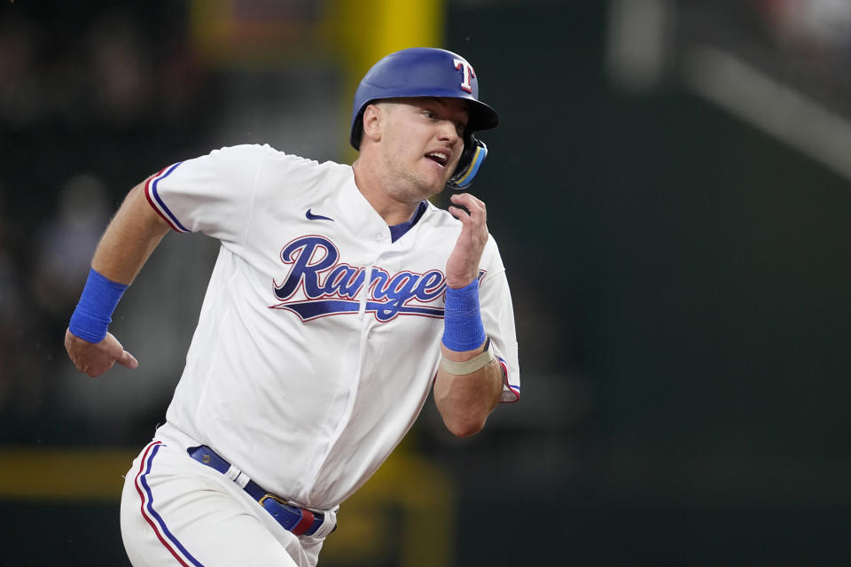 Texas Rangers' Josh Jung advances to third on a double by Adolis Garcia in the fourth inning of a baseball game against the Boston Red Sox, Wednesday, Sept. 20, 2023, in Arlington, Texas. (AP Photo/Tony Gutierrez)