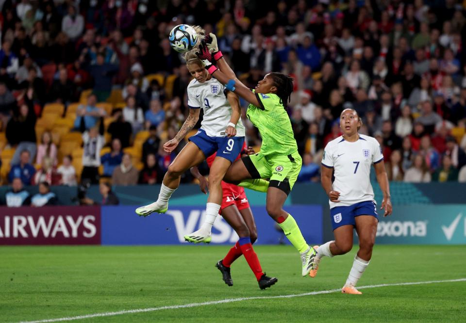 Haiti goalkeeper Kerly Theus (right) catches a high ball ahead of England's Rachel Daly (left) during the FIFA Women's World Cup 2023, Group D match at Lang Park, Brisbane. Picture date: Saturday July 22, 2023.