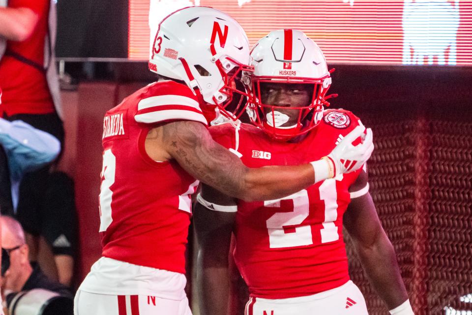 Nebraska Cornhuskers running back Emmett Johnson (21) and wide receiver Isaiah Garcia-Castaneda (13) celebrate after a touchdown against the Northern Iowa Panthers during the fourth quarter at Memorial on Saturday in Lincoln, Nebraska.