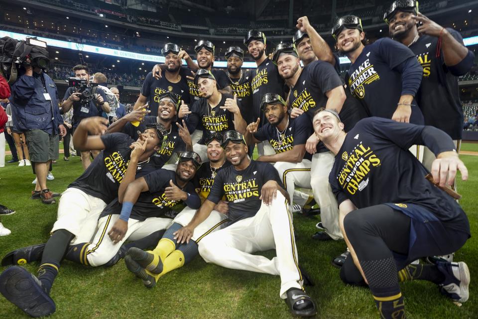 Milwaukee Brewers' players celebrate after clinching the National League Central Division after a baseball game against the St. Louis Cardinals Tuesday, Sept. 26, 2023, in Milwaukee. (AP Photo/Morry Gash)