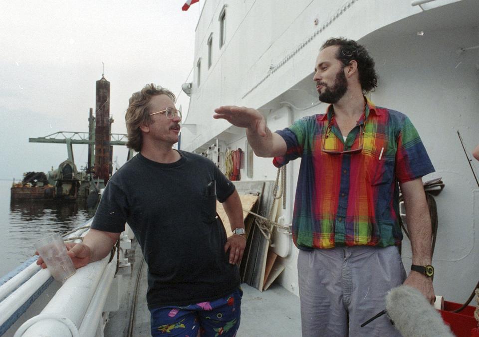 Tommy Thompson, right, talks with Bob Evans on the Arctic Discoverer as they depart Norfolk, Va., on  June 18, 1991. Thompson led a group that recovered millions of dollars worth of sunken treasure only to end up involved in court cases brought by dozens of insurance companies laying claim to the treasure.