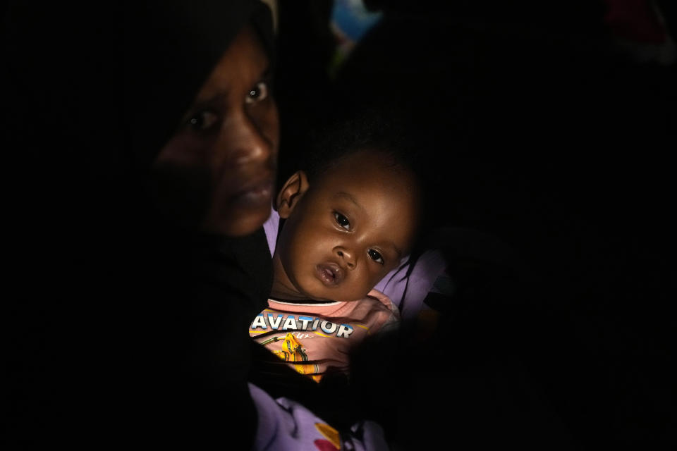 Sudanese evacuees wait before boarding a Saudi military ship to Jeddah port, at Port Sudan, Sudan, late Tuesday, May 2, 2023. Many are fleeing the conflict in Sudan between the military and a rival paramilitary force. (AP Photo/Amr Nabil)