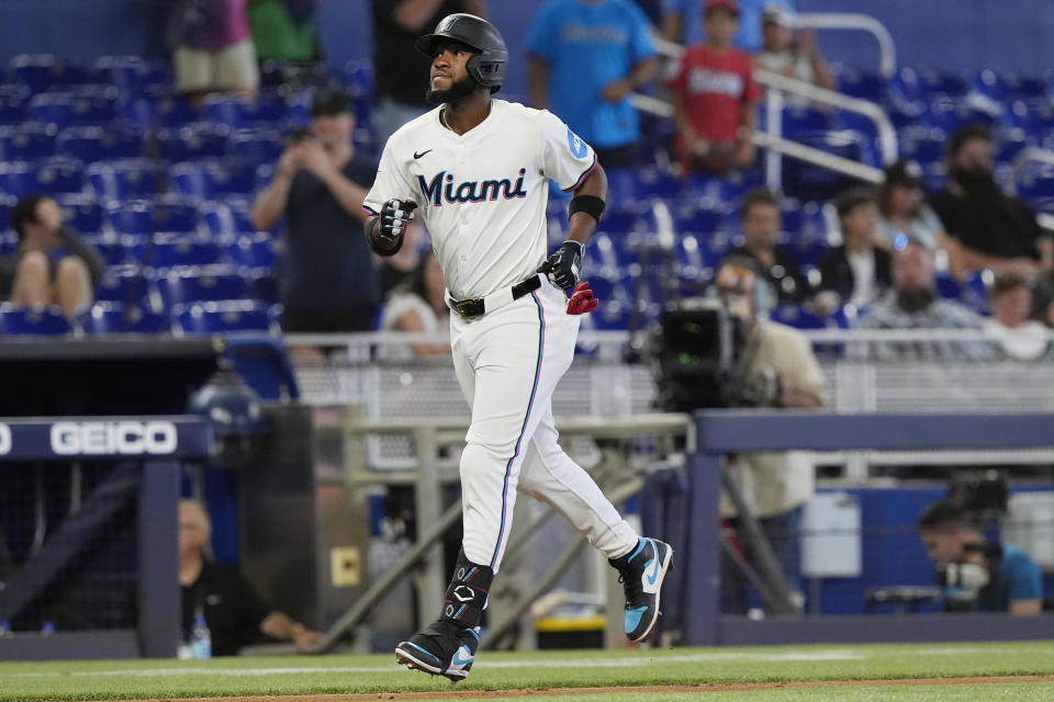 Miami Marlins' Bryan De La Cruz runs to home plate after hitting a home run during the sixth inning of a baseball game against the San Francisco Giants, Wednesday, April 17, 2024, in Miami. (AP Photo/Marta Lavandier)