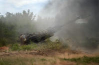 Ukrainian soldiers fire at Russian positions from a U.S.-supplied M777 howitzer in Ukraine's eastern Donetsk region Saturday, June 18, 2022. (AP Photo/Efrem Lukatsky)